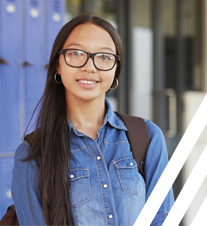 Asian girl with glass standing against blue lockers